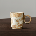 Ceramic mug with a textured surface on a wooden table