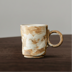 Ceramic mug with a textured surface on a wooden table